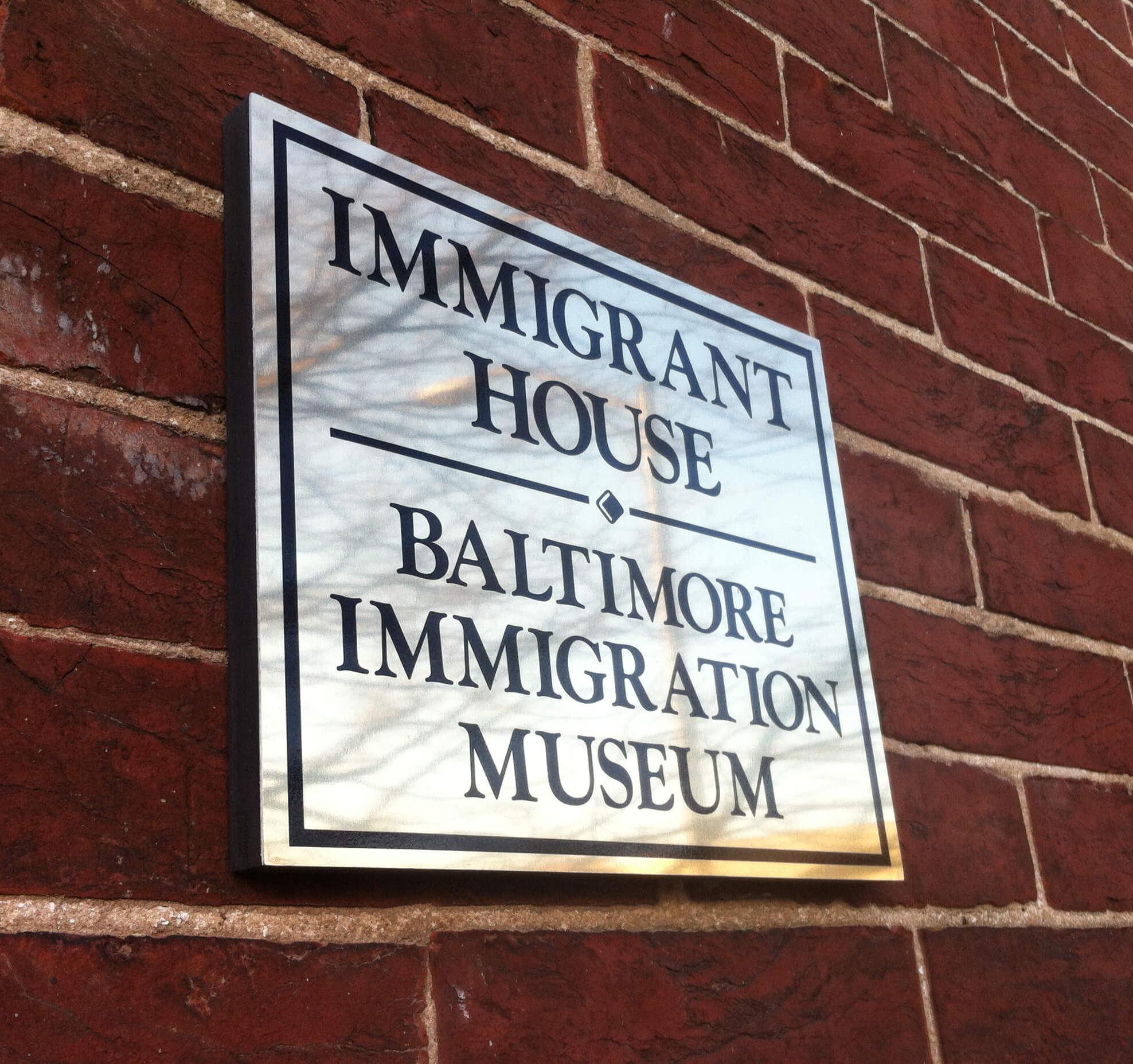 Museum building window with the logo and name